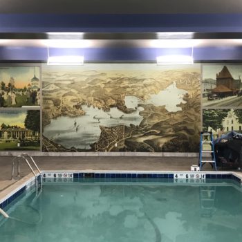 Wall mural for indoor pool space featuring historical images for Harbor Hotel