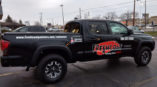 Vehicle wrap graphics for Freshcoat black pickup truck