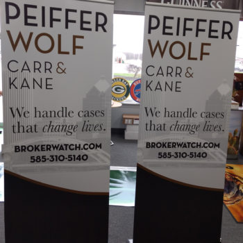 Two Peiffer Wolf banner stands for broker watch