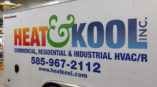 Vehicle wrap graphics for Heat & Kool side of white trailer