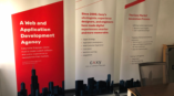 Three CAXY retractable banners