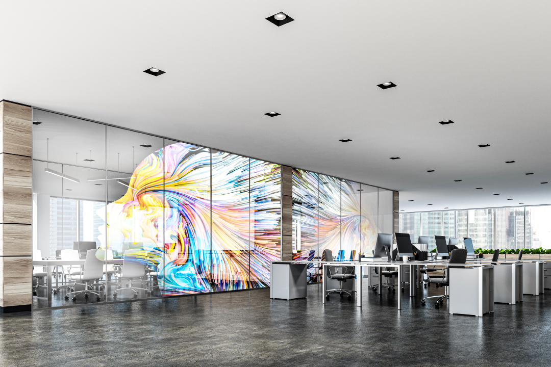 Interior design office with colorful mural and modern furniture
