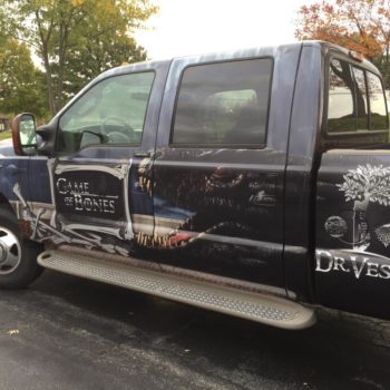 Custom decals on a vehicle wrapped truck 