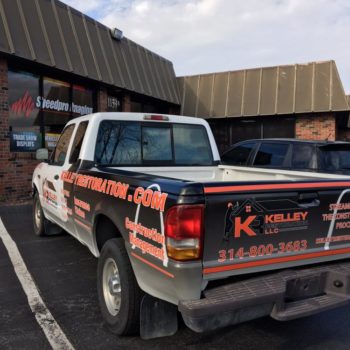 Kelley Restoration LLC finished black and white vehicle wrapping