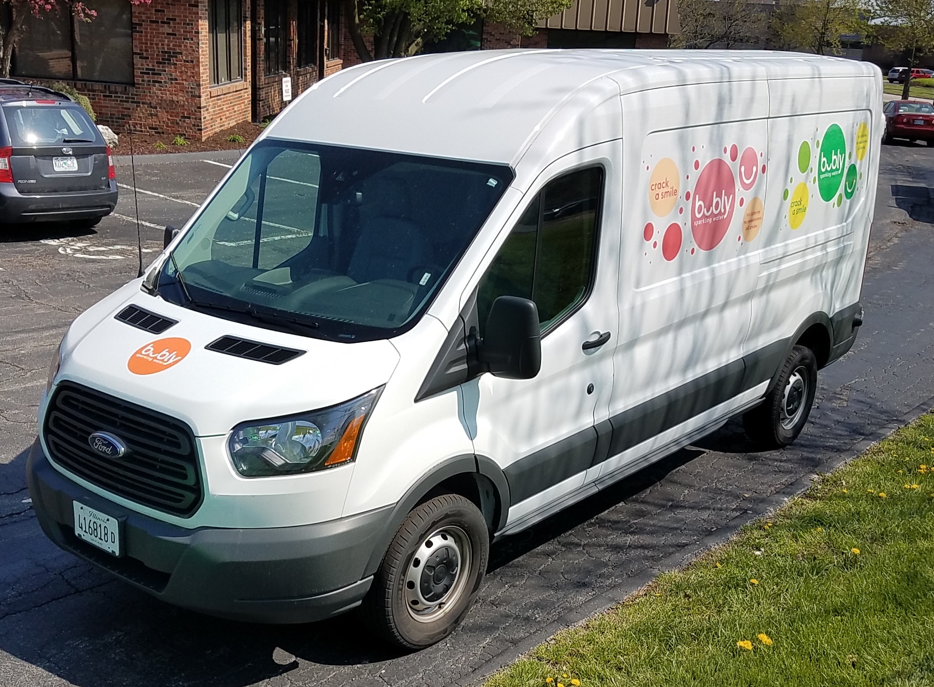 A large work van with custom designed vehicle prints on the side for Bubly sparkling water.