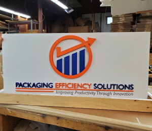 Sign on table for Packaging Efficiency Solutions