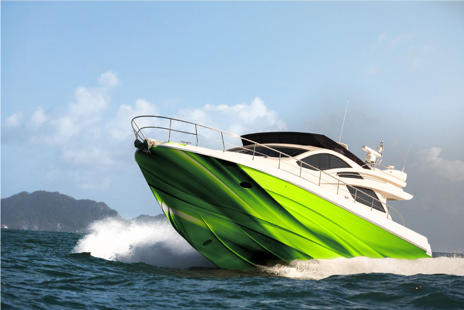 Green and white motorboat on water