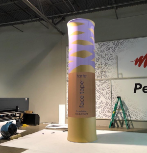 Tube-shaped object display in room, enhancing visual appeal with modern design.