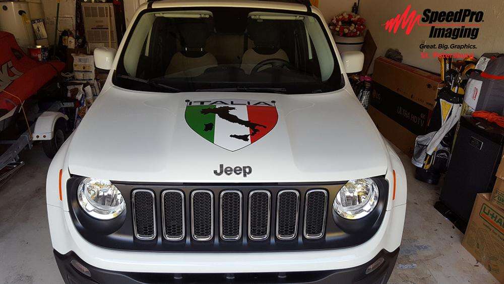 Italia vehicle decal on hood of white jeep renegade