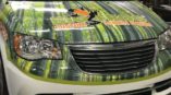 vehicle wrap for Big Frog custom t shirts and more on front of white chrysler van