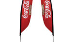 two red Coca Cola Vanila flag signage