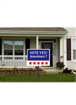 yard sign in front of house that reads 