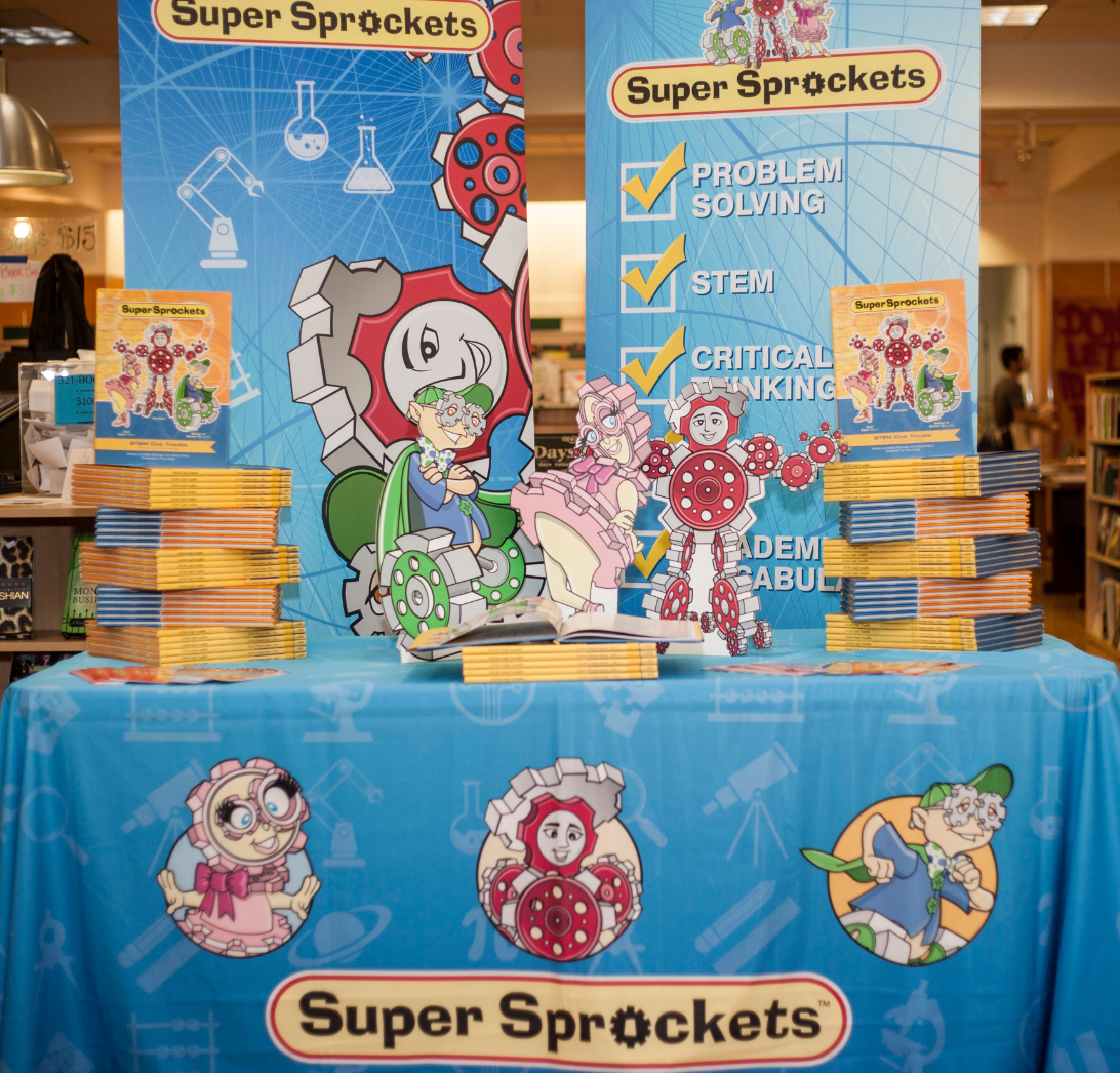 Super Sprockets table topper and display with stacks of books