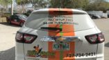 back view of white chevy suv with vehicle wrap for Big Frog Custom T-Shirts & More