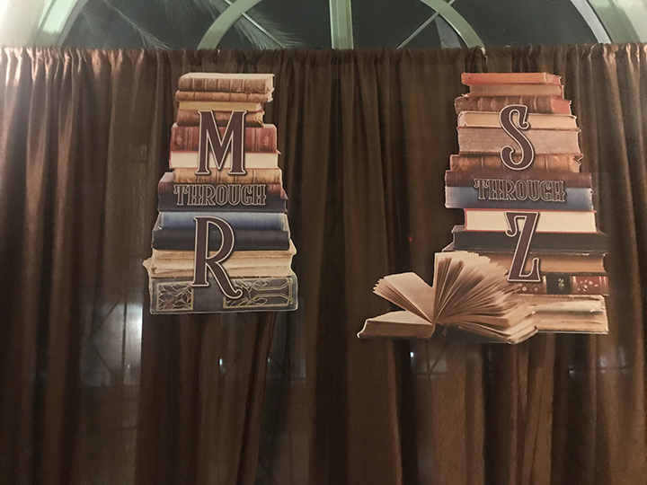 foamcore sign of books with letter overlay