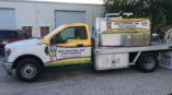 white work truck with vehicle wrap for ABC Pest Control, Inc