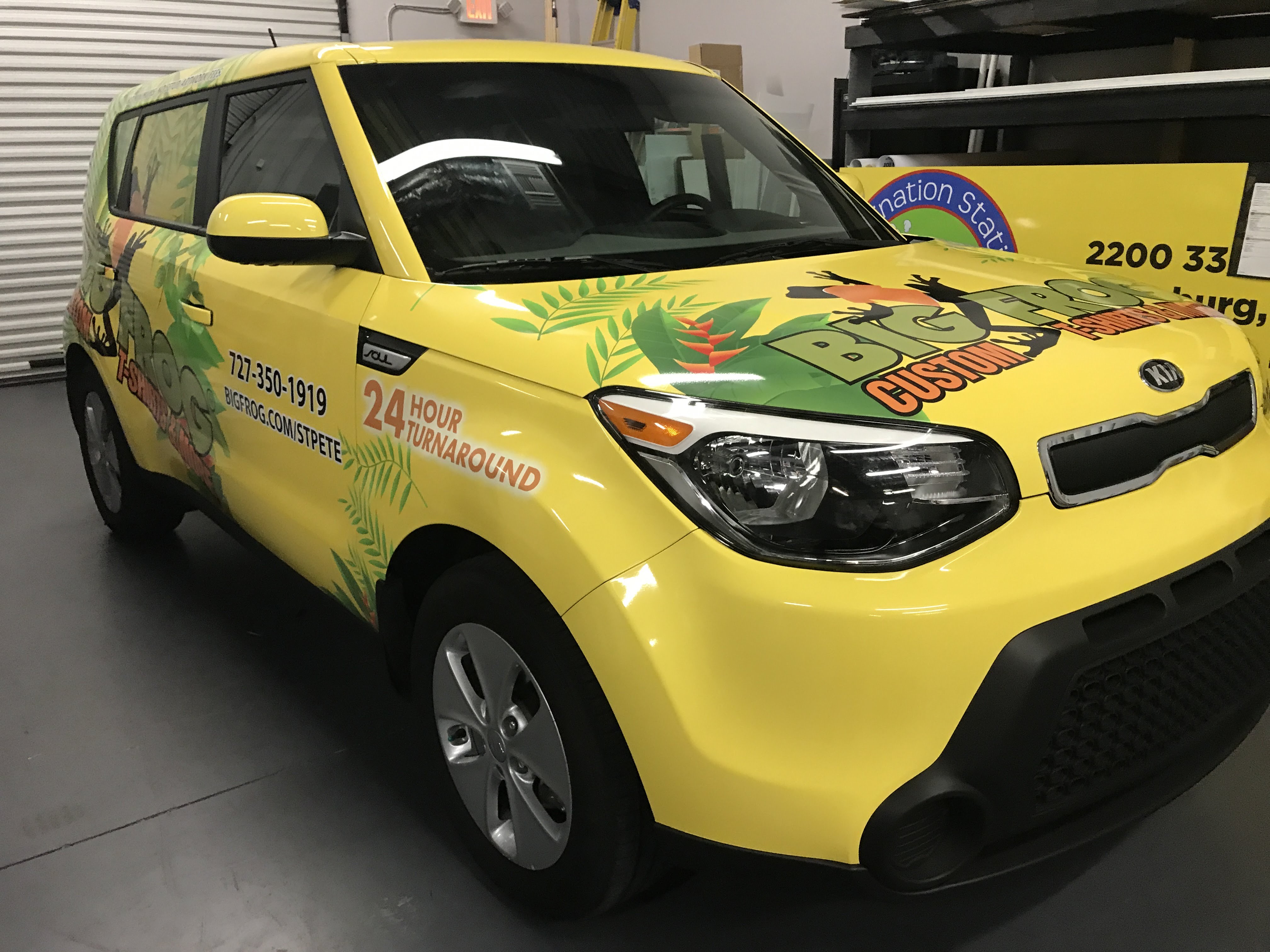 bright yellow kia soul with vehicle wrap for Big Frogs Custom T-Shirts & more