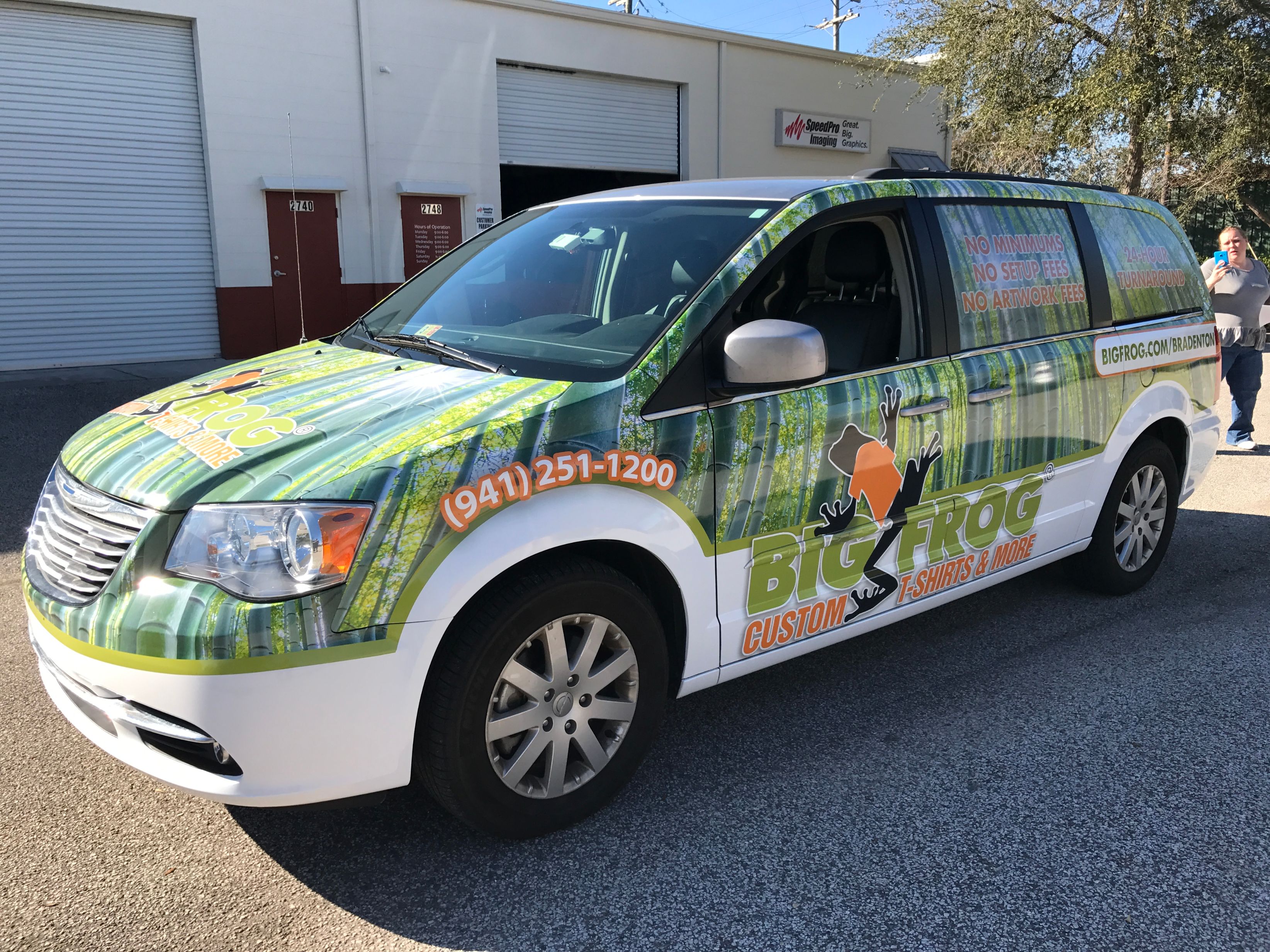 white van covered in vehicle wrap for Big Frog Custom T-Shirts & More