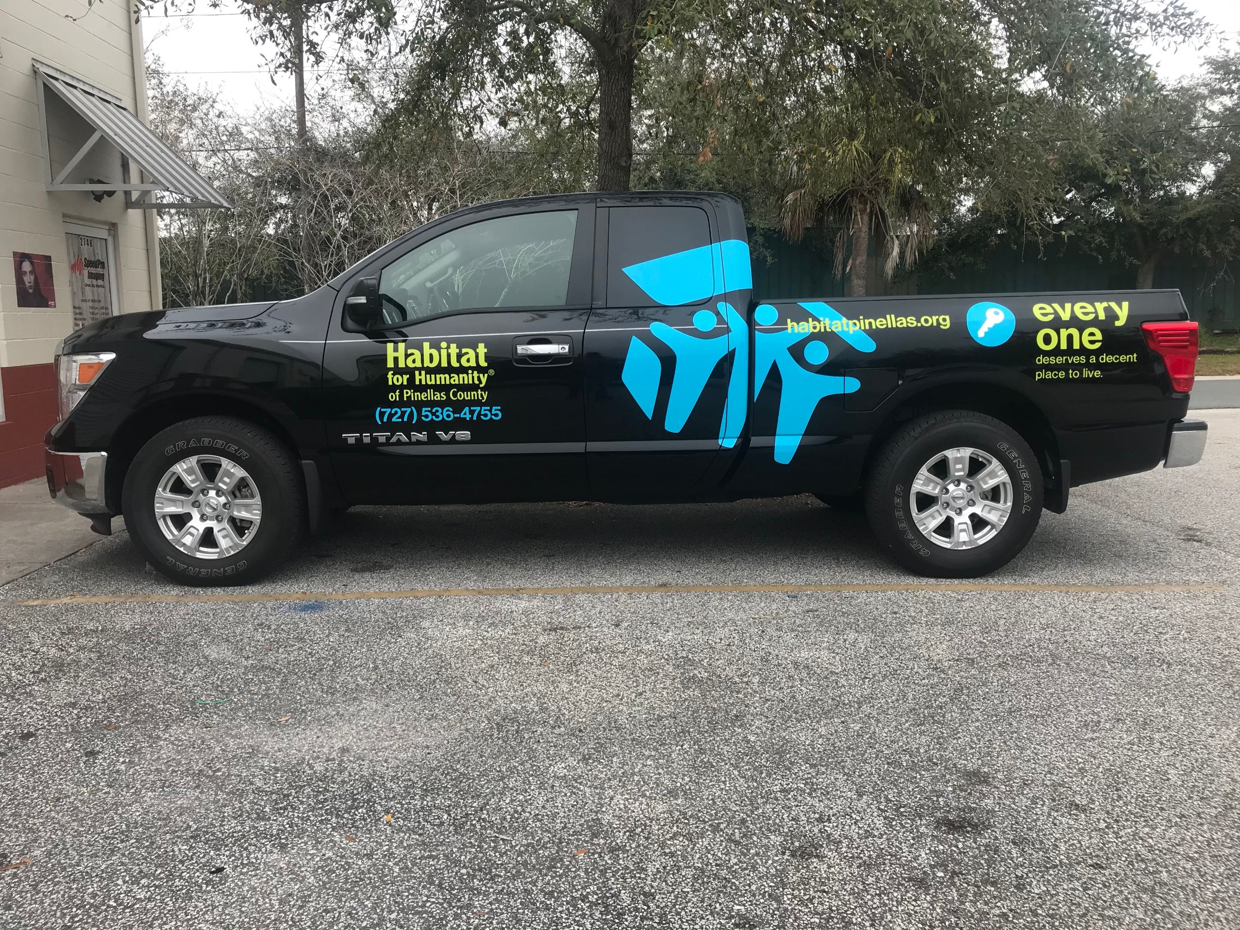 black truck with vehicle decal that reads Habitat for Humanity of Pinellas County