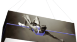 rectangular fabric hanging structure of man jumping over pole 