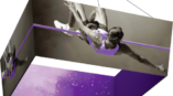 tapered square fabric hanging structure of man jumping over pole purple inside 
