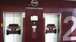 elevator wraps of red nissan car