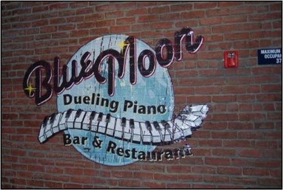 wall graphic on brick wall for Blue Moon Dueling Piano Bar & Restaurant