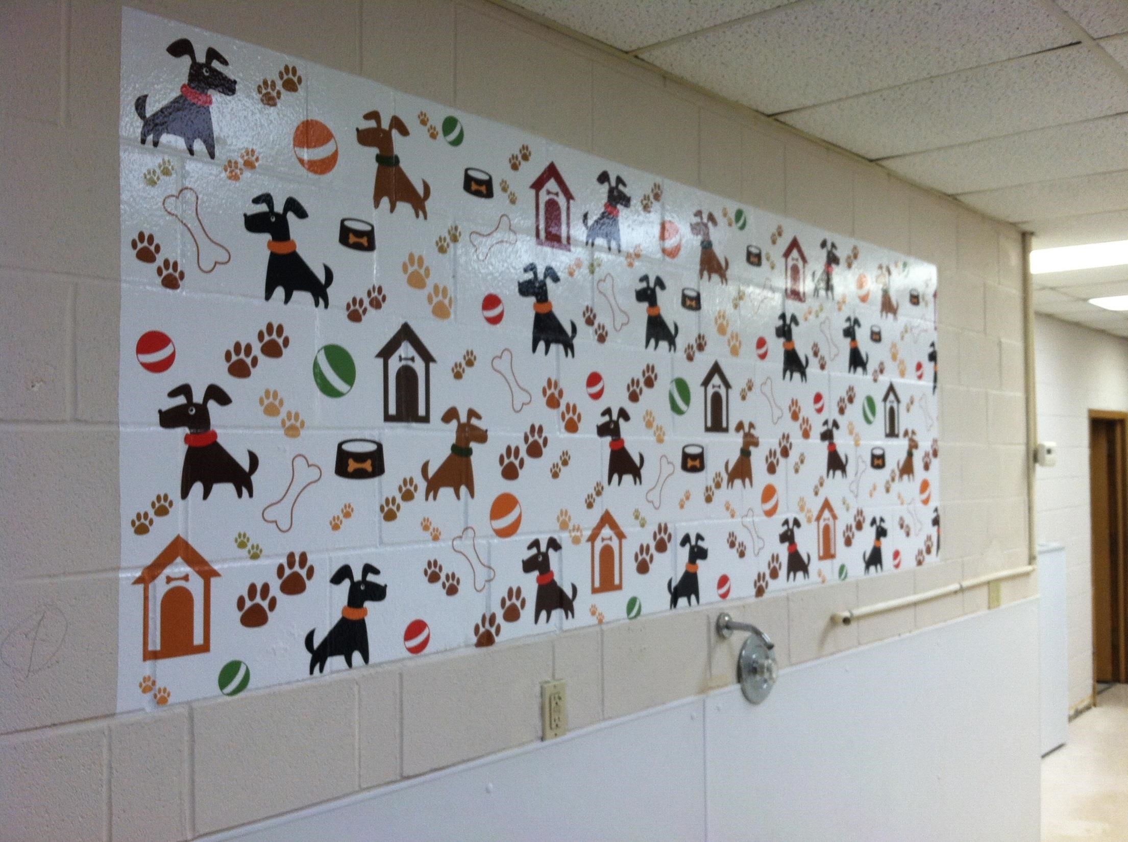 wall mural of cartoon dogs, dog houses and paw prints