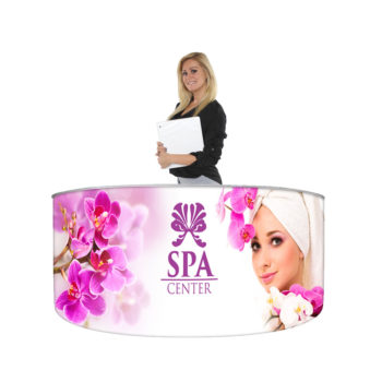 woman standing behind curved cinco frame ez fabric counter for spa center