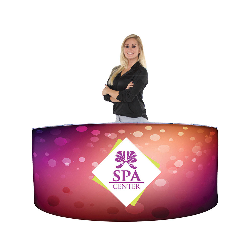 woman standing behind ez fabric counter curved triple graphic package for spa center