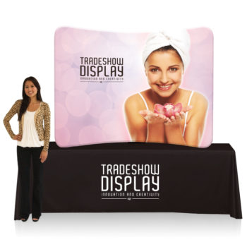 woman standing in front of ez tube and table top package for trade show display