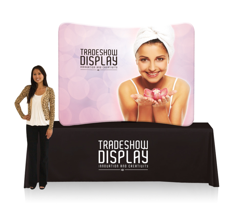 woman standing in front of ez tube and table top package for trade show display