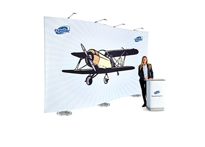 woman standing in front of expolinc fabric system aeroplane