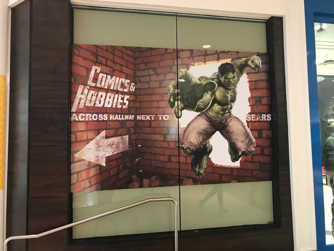 directional window mural for comics & hobbies with image of the Hulk