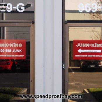 Junk King window sign
