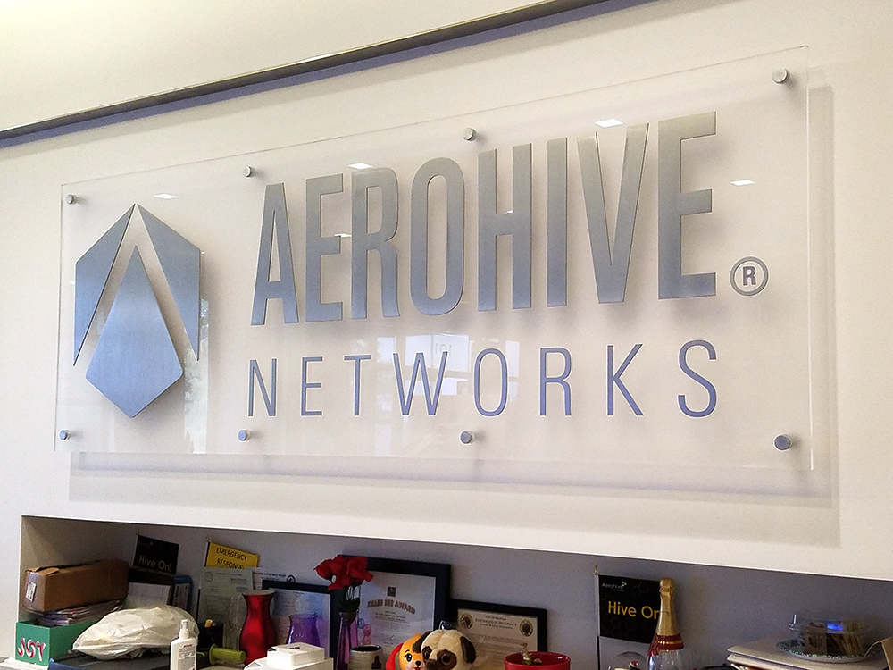 Clear sign with silver lettering for Aerohive Networks