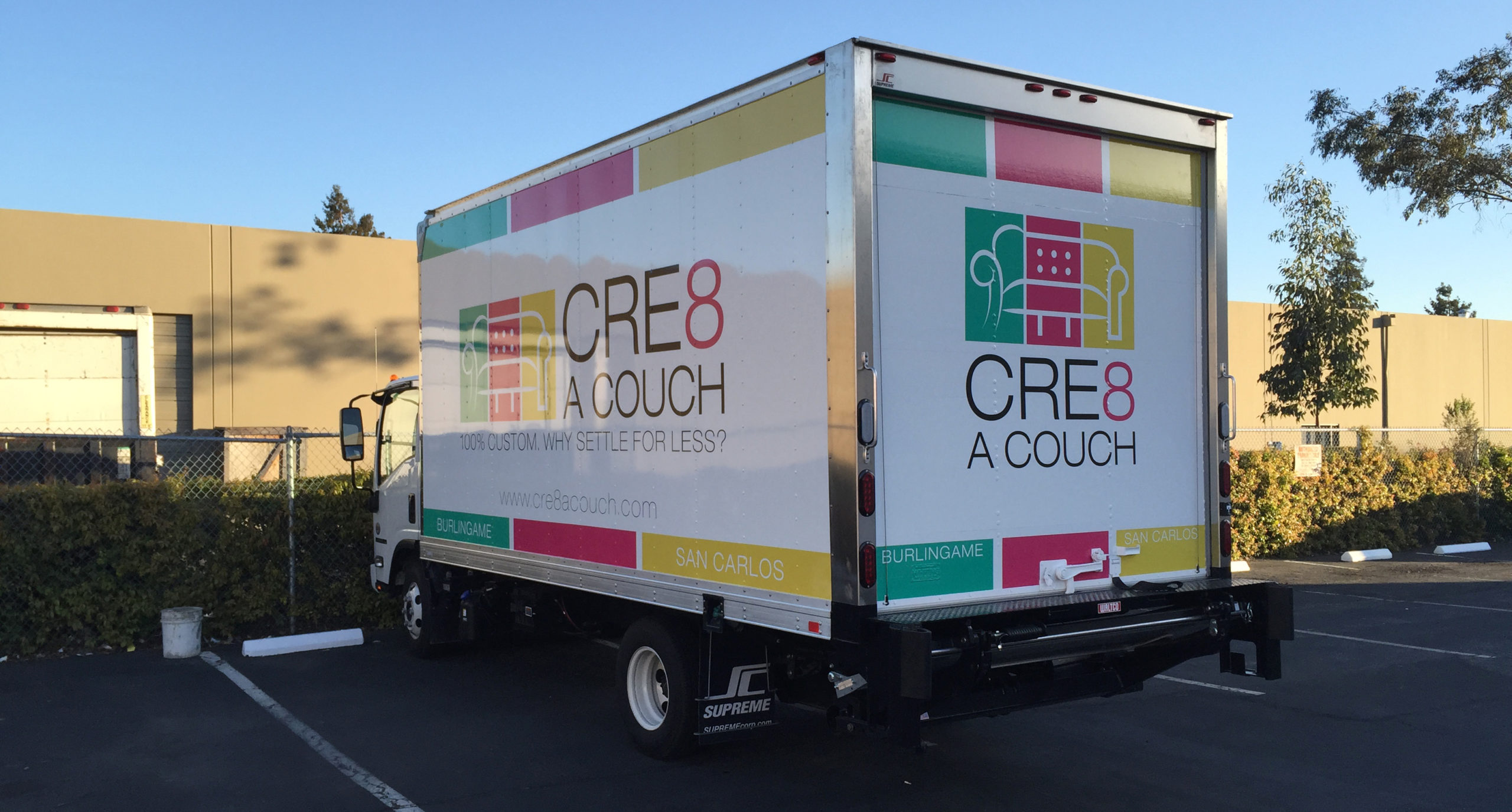Cre8 a  Couch truck wrapped in advertisements