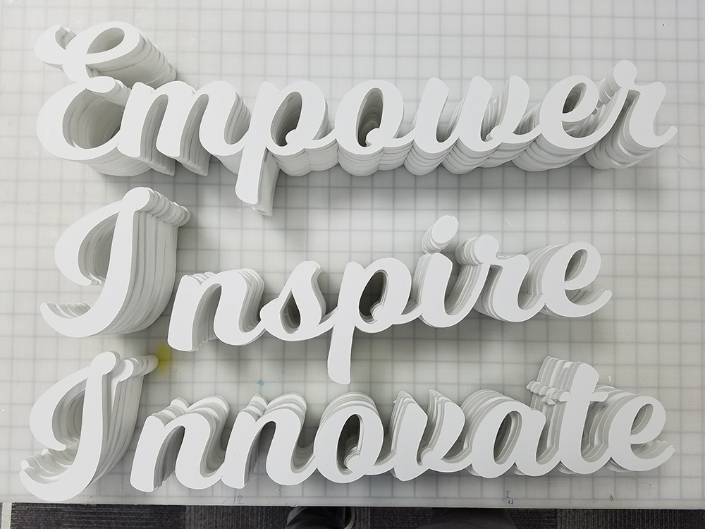 empower, inspire, innovate words popping out from wall