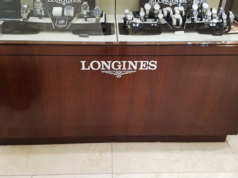 Longines dimensional letter sign on watches display case