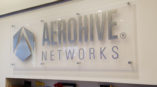 Clear ACRYLIC sign with silver lettering for Aerohive Networks