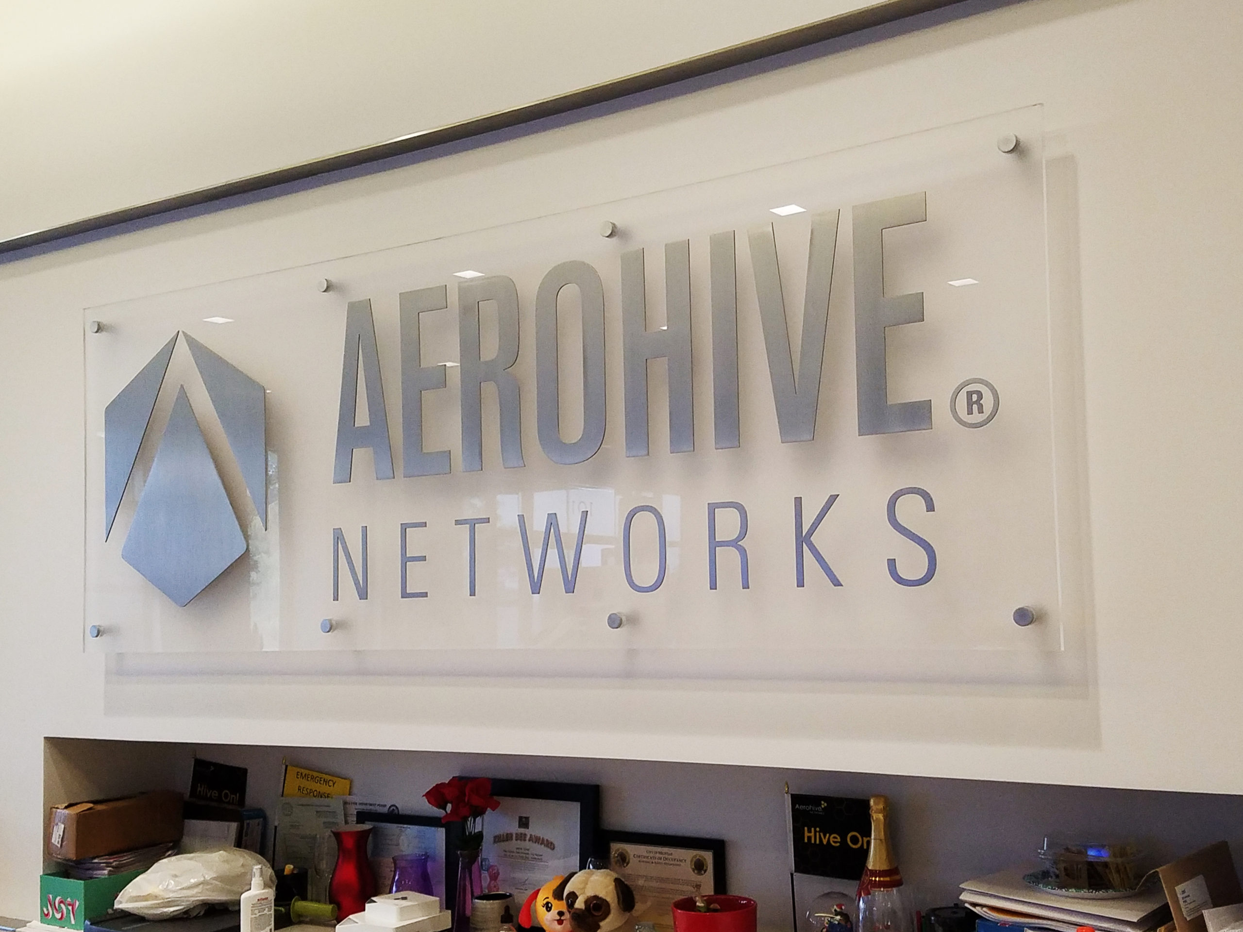 Clear ACRYLIC sign with silver lettering for Aerohive Networks