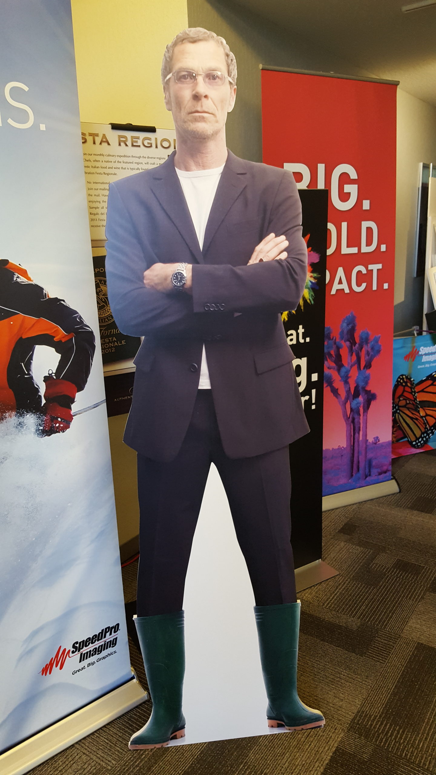 standing cardboard cutout of man in suit
