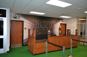 college branded nike mural wall behind counter 