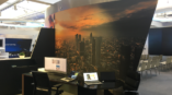 city scape on wall in front of desk 