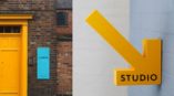 large yellow arrow sign to studio 