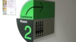 conference room green directional sign 
