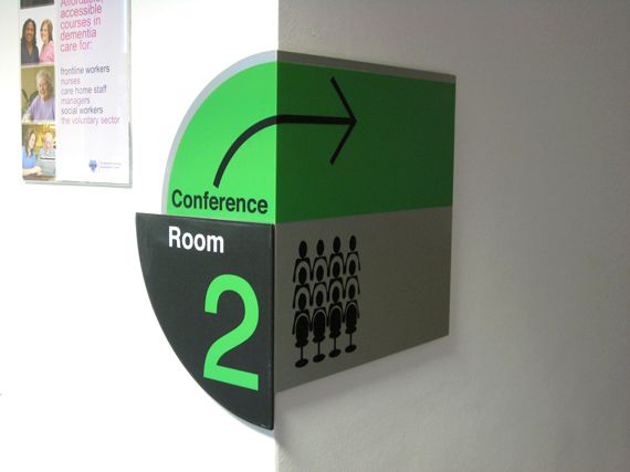 conference room green directional sign 