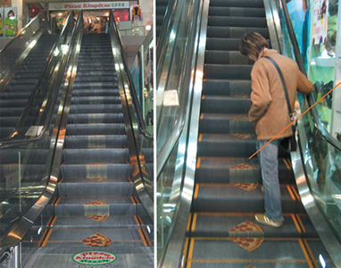 Pizza slice decals on escalator steps