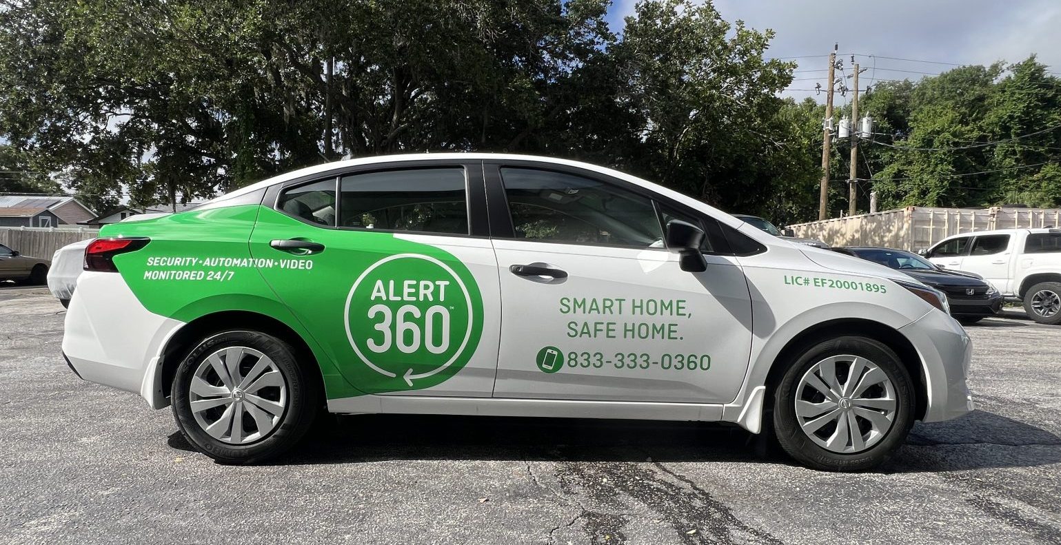 Custom fleet vehicle wrap for Alert 360 with high-resolution printed graphics and branded design elements for commercial mobile marketing.