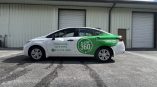 Custom commercial vehicle graphics for Alert 360 featuring full-color branded wrap elements professionally installed for fleet branding and mobile advertising.